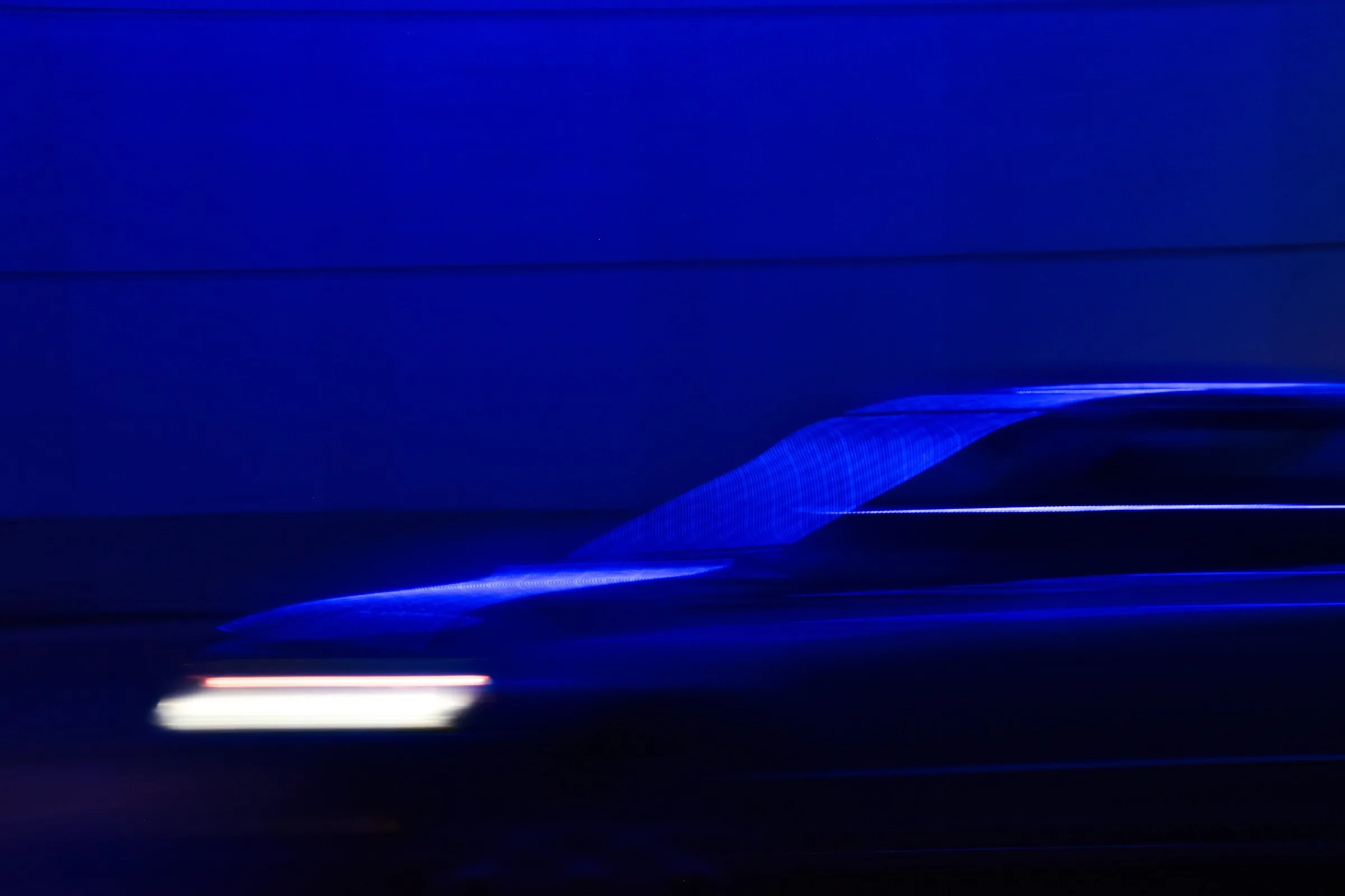 Abstract blue motion representing content moving through a governed workflow
